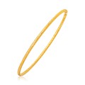 Fancy Textured Thin Stackable Bangle in 14k Yellow Gold